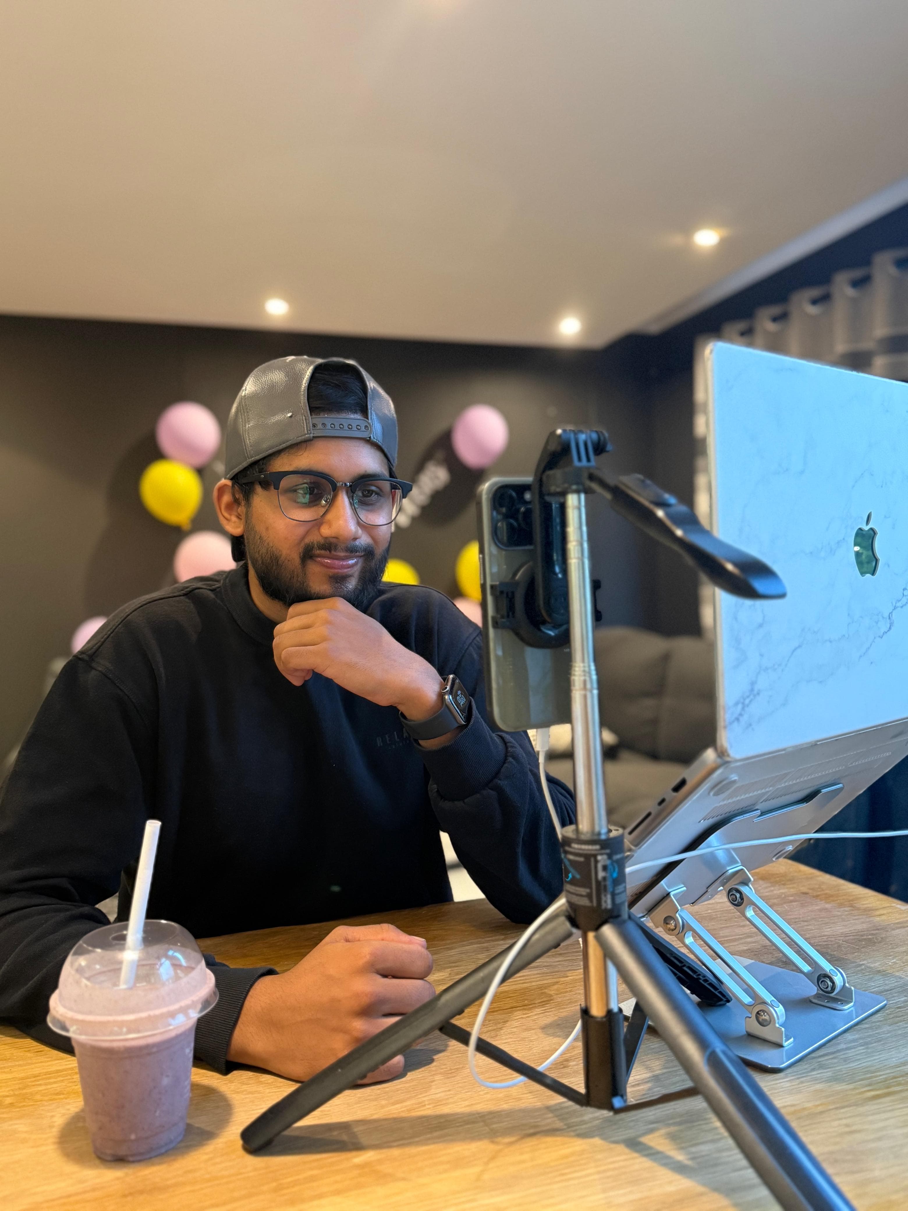 Akhil at his desk creating content
